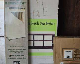 New in boxes: portable closet, TV stand or bookcase shelf, computer stand or standing to work