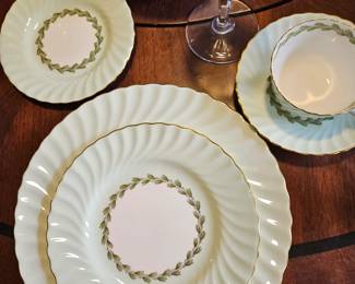 8 five piece place settings of Cheviot green rim by Minton