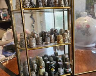 Thimble collection in glass case. Sold as a collection only.