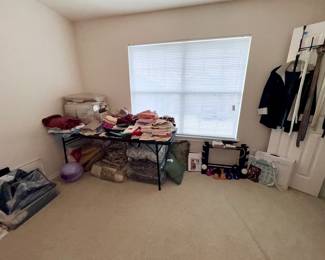 Bedroom 3 upstairs Linens, another closet full of very nice clothes, weights, yoga and more