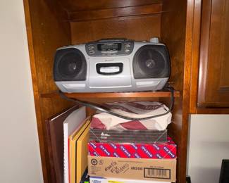 Portable Cd radio player, paper, folders and more