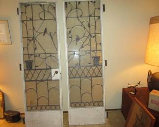 Forged metal and iron doors with leaded glass and bird detailing. From the Joshua Green mansion.