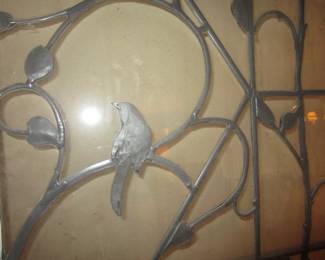 Forged metal and iron doors with leaded glass and bird detailing. From the Joshua Green mansion.