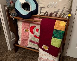 Quilts, pillows, quilt rack