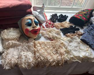 handmade laces, linens, gloves and a mask from Italy