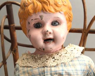 Victorian wicker doll pram with antique doll