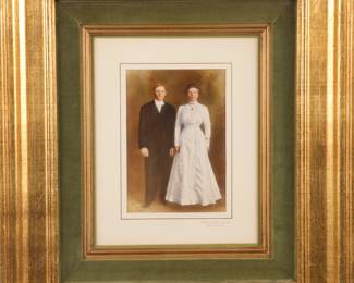 Antique colorized photograph in giltwood frame