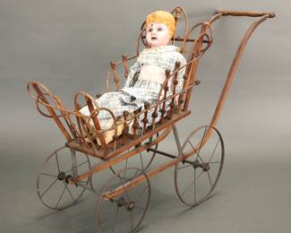 Victorian wicker doll pram with antique doll
