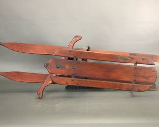 Antique wooden tobaggan sled with mechanical steering
