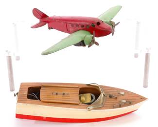 Vintage wooden boat with motor/ pressed steel airplane