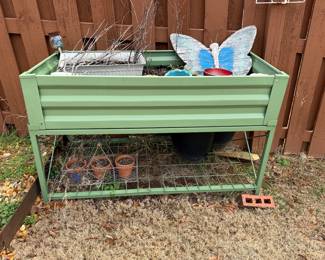 #55 Raised metal planter 47x24x27 with dirt $40.00
