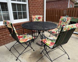#53 Wrought iron table with 4 bouncy chairs and cushions $175.00