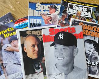 Large collection of Atlanta Braves bobbleheads and other sports memorabilia in original boxes, plus vintage Sports Illustrated magazines.