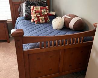 Modern bedroom set includes twin headboard, footboard and wood rails, box springs, dresser and mirror, nightstand, and desk with hutch.