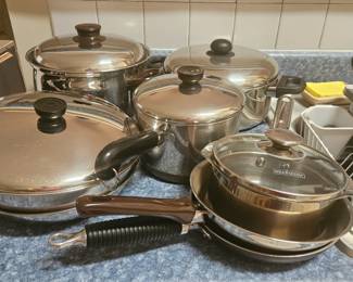 Various kitchen pots and pans, dishes bakeware and containers.