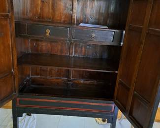 INTERIOR OF ANTIQUE ORIENTAL CHEST