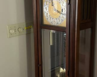 COLONIAL GRANDFATHER CLOCK.  $150.00 AVAILABLE FOR IMMEDIATE PURCHASE WITH PICK UP DURING THE SALE