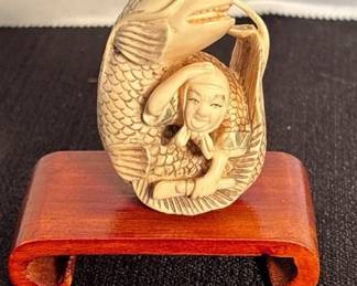 Antique Japanese Netsuke Fish Wrapped Person