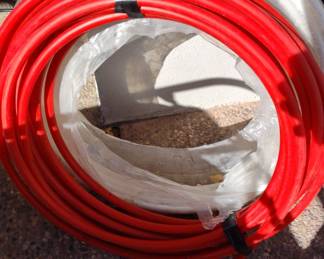 12 Red And White Rolls Of PVC Pipe