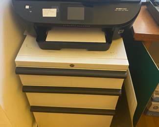 Storage cabinet.  May have the key and printer with extra ink cartridge