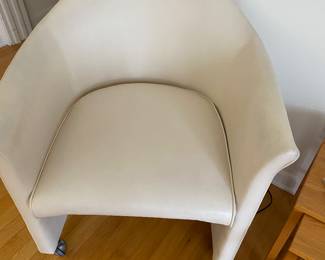 There are 5 of these leather chairs on casters.  Two upstairs and 3 downstairs