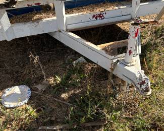 Flatbed utility trailer. Located underneath lift