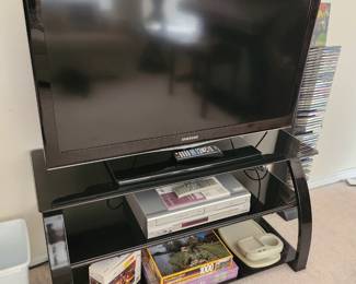 TV, DVD/VHS player, stand, puzzles