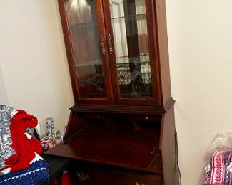 #49	2 pc sectary with 3 drawers, 2 glass bevel doors drop front desk lighted 32x17-26x82	 $175.00 			
