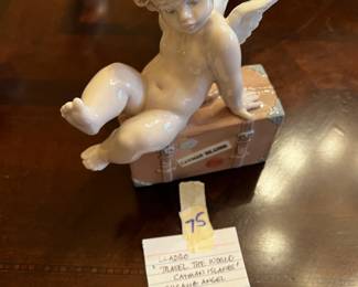#75	Lladro "Travel the World Cayman Islands" Cherub Angel w/Box	 $45.00 			
