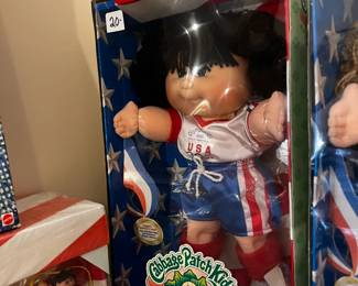 #301		cabbage patch doll olymikids black hair	 $20.00 			
