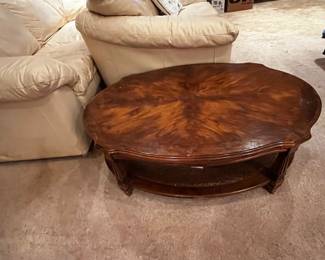 #10	oval coffee table with wicker shelf on bottom 44x30x15 as is finish 	 $30.00 			

