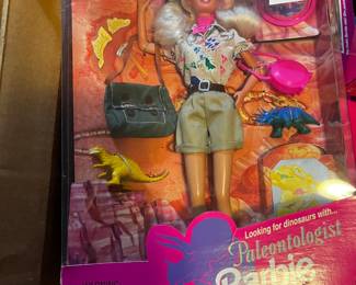 #246	barbie looking for dinosaurs with Paleontologist 	 $25.00 			

