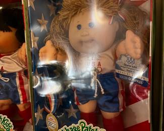 #299		cabbage patch doll Olymikids red head with short/tank	 $20.00 			
