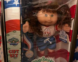 #303 cabbage patch doll olymikids brown pigtail shorts/shirt	 $20.00 			
