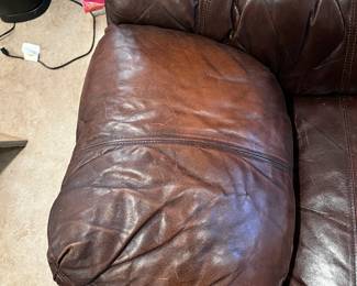 as is arm finish #25	double recliner brown leather sofa with middle cup holder 89 long as finish 	 $325.00 			
