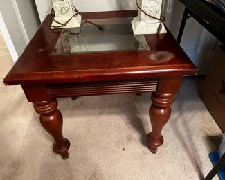 #53	square glass insert top end table as is water mark  24x22	 $45.00 			
