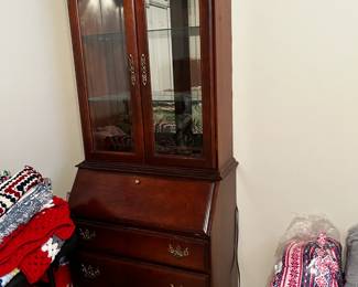 #49	2 pc sectary with 3 drawers, 2 glass bevel doors drop front desk lighted 32x17-26x82	 $175.00 			
