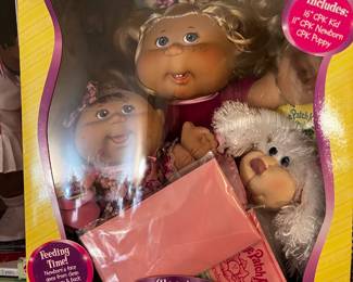 #294	cabbage patch doll family portrait with dog and baby 	 $50.00 			
