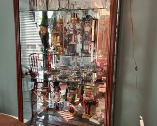 slim lined, lighted glass and wood display cabinet