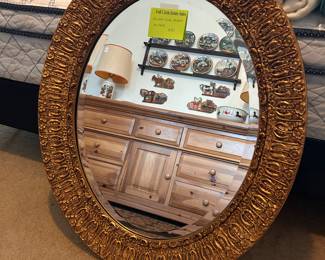 beautiful oval gilded wall mirror