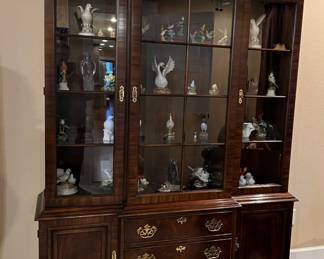 split pediment wooden china cabinet, bird figurines