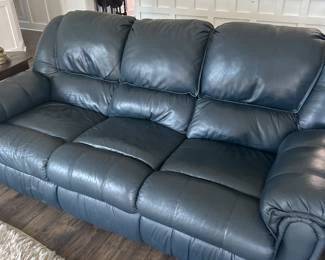 Blue reclining sofa in excellent condtion