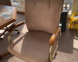 closeup of chair on rollers, we have a table & 4 chairs