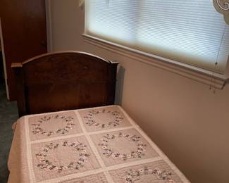 Footboard of antique Italian twin bed