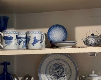 Delft blue on the upper shelf and other asian blue and white items