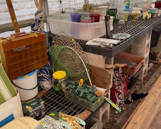 It's a long greenhouse packed for of various items waiting for you to give them a a new home