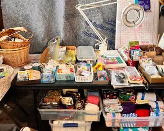Sewing and art and craft supplies.  Oh, and that giant gray covered items - that's a gorgeous King Sized headboard - dark wood, we will remove the protective covering before the sale opens