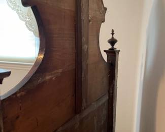 Backside of headboard on the antique Italian twin bed