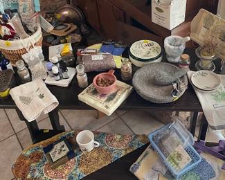 Take a journey into herbs and herb gardening displayed on this vintage table and bench