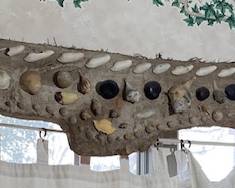 Check this out!  A large drift wood and seashell valance!  Great unexpected display piece and a conversation item.  Great for rustic beach themed decor spaces, beach houses, and more